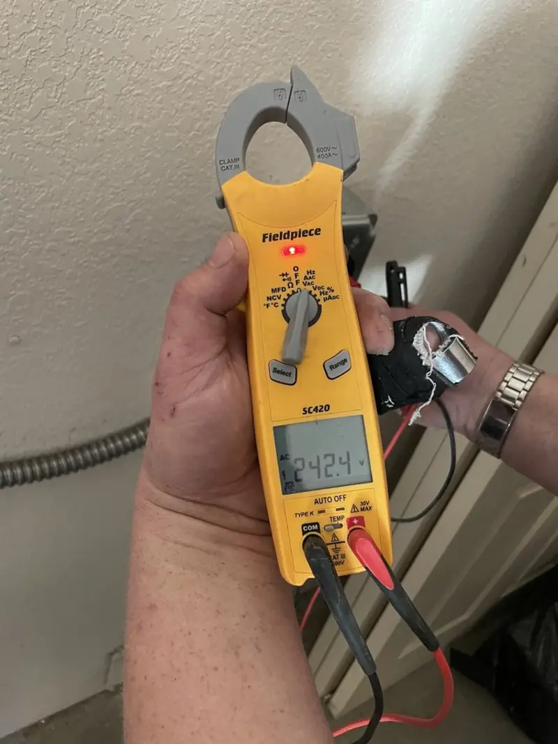 Voltage testing with clamp meter during Outlet Installation in Laurel